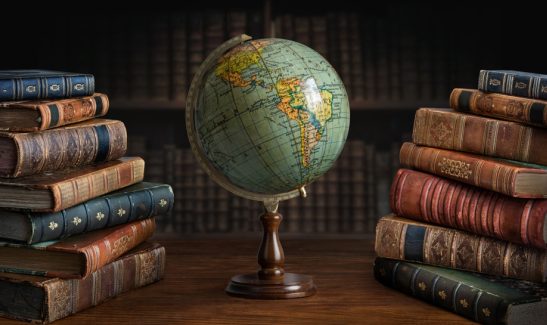 Old,Geographical,Globe,And,Old,Book,In,Cabinet,With,Bookselfs.